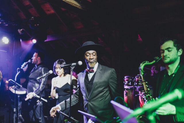 Wedding reception band performing for guests at Riverside Farm