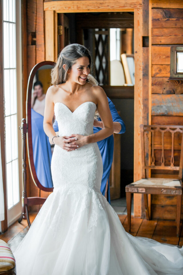 Bride getting ready in a rustic room at Riverside Farm