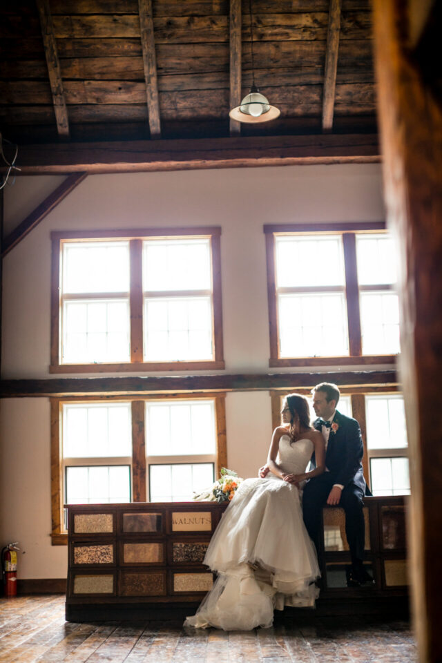 Bride seated near windows during wedding preparations