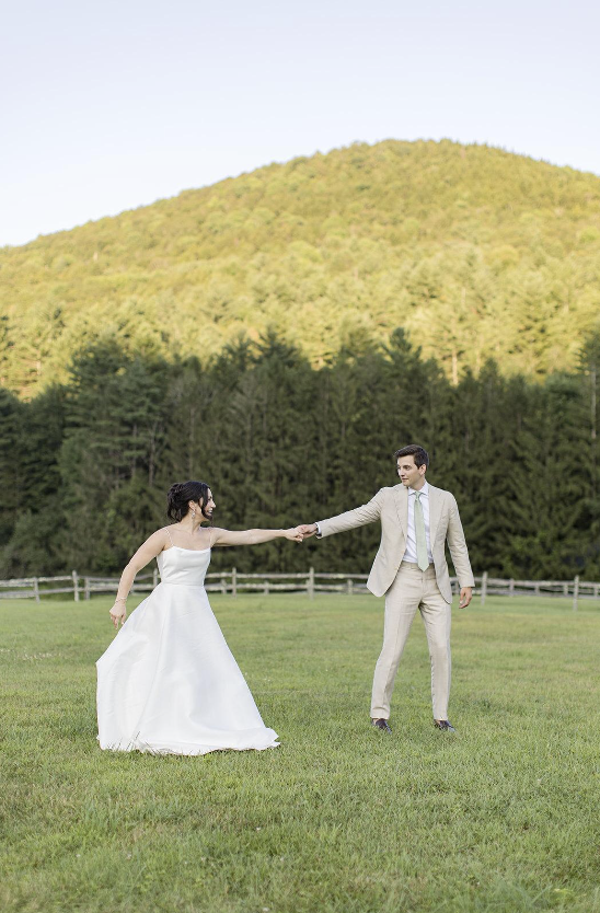 Bride & Groom holding hands
